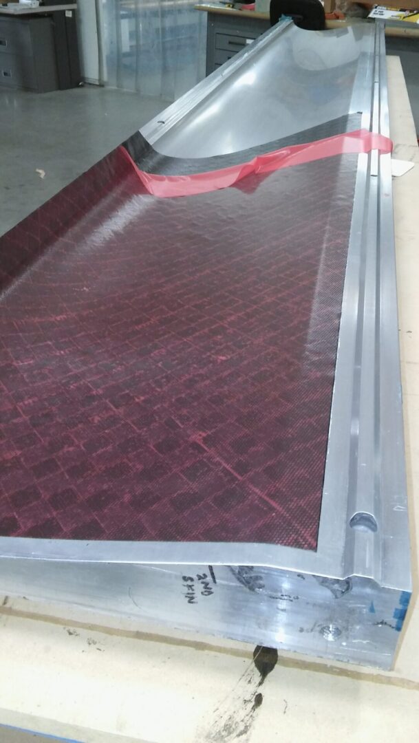 A red tile floor with a metal frame.